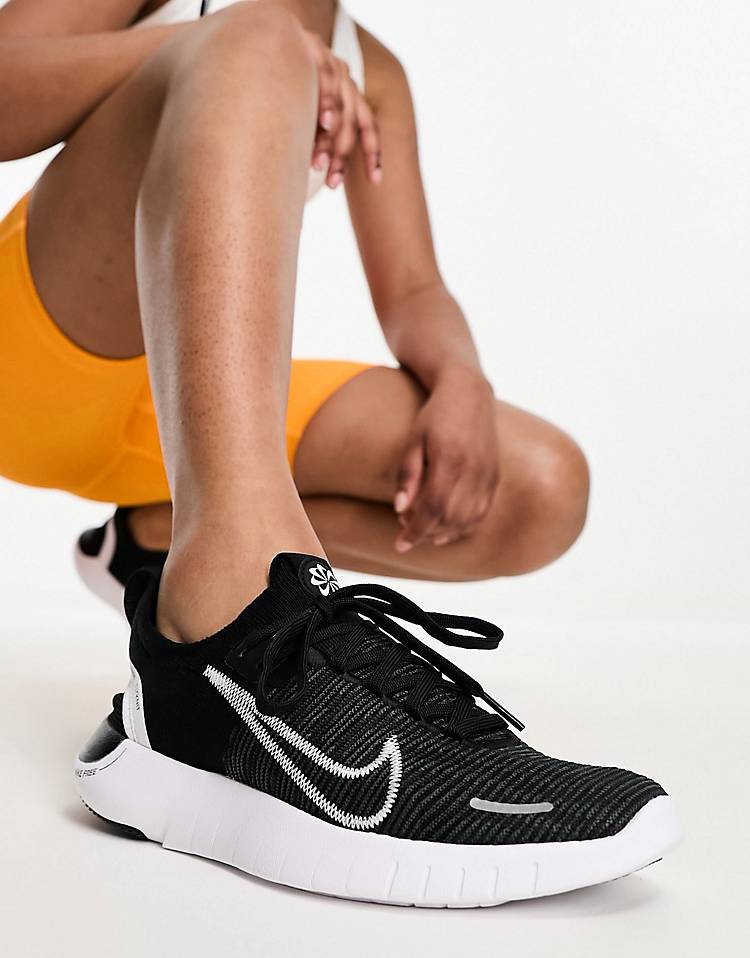 Nike Free Run Flyknit sneakers in black & white